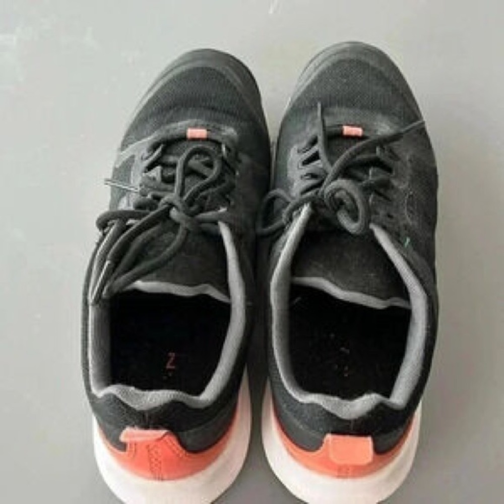 Black Sneakers with Coral Accent